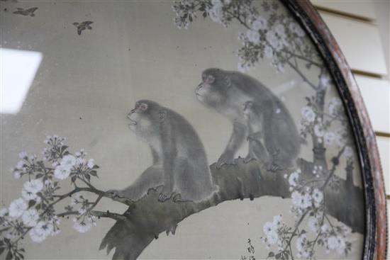 A Japanese watercolour on silk of two monkeys, Meiji period, 61cm diameter